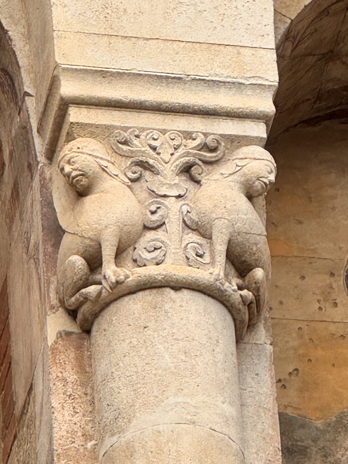 Two winged creatures flank a stylised plant, a motif inherited from the East in which guardians protect a tree of life