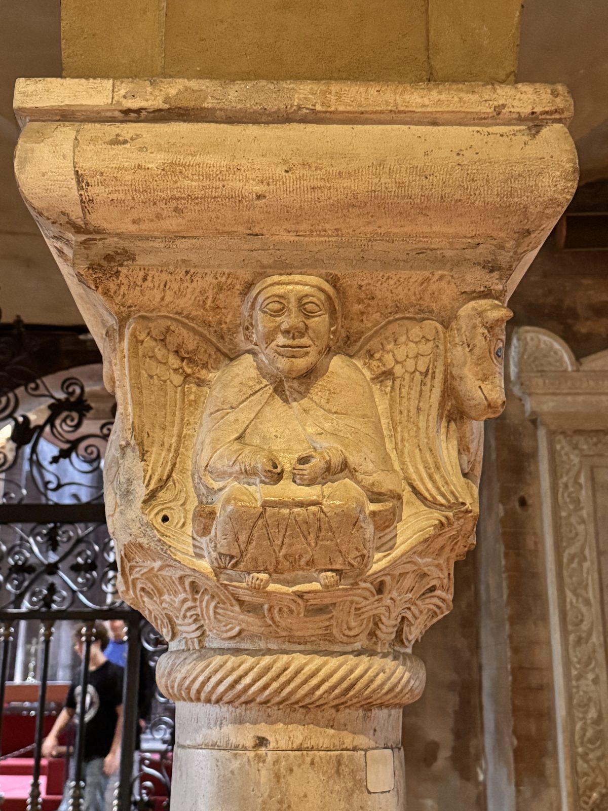 A winged figure holding a book, perhaps the angel of Saint Matthew, one of the four symbols of the Evangelists
