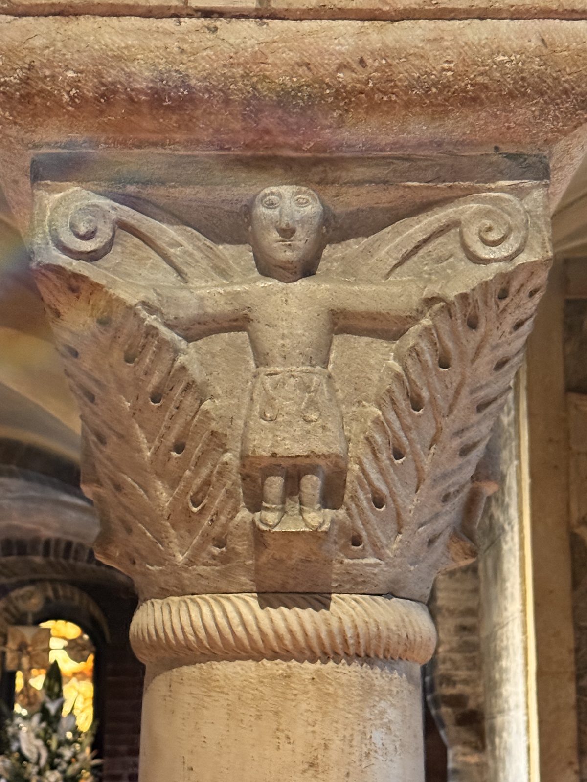 A frontal human figure between palm fronds: the palm, symbol of victory and martyrdom, frames the image of the faithful soul
