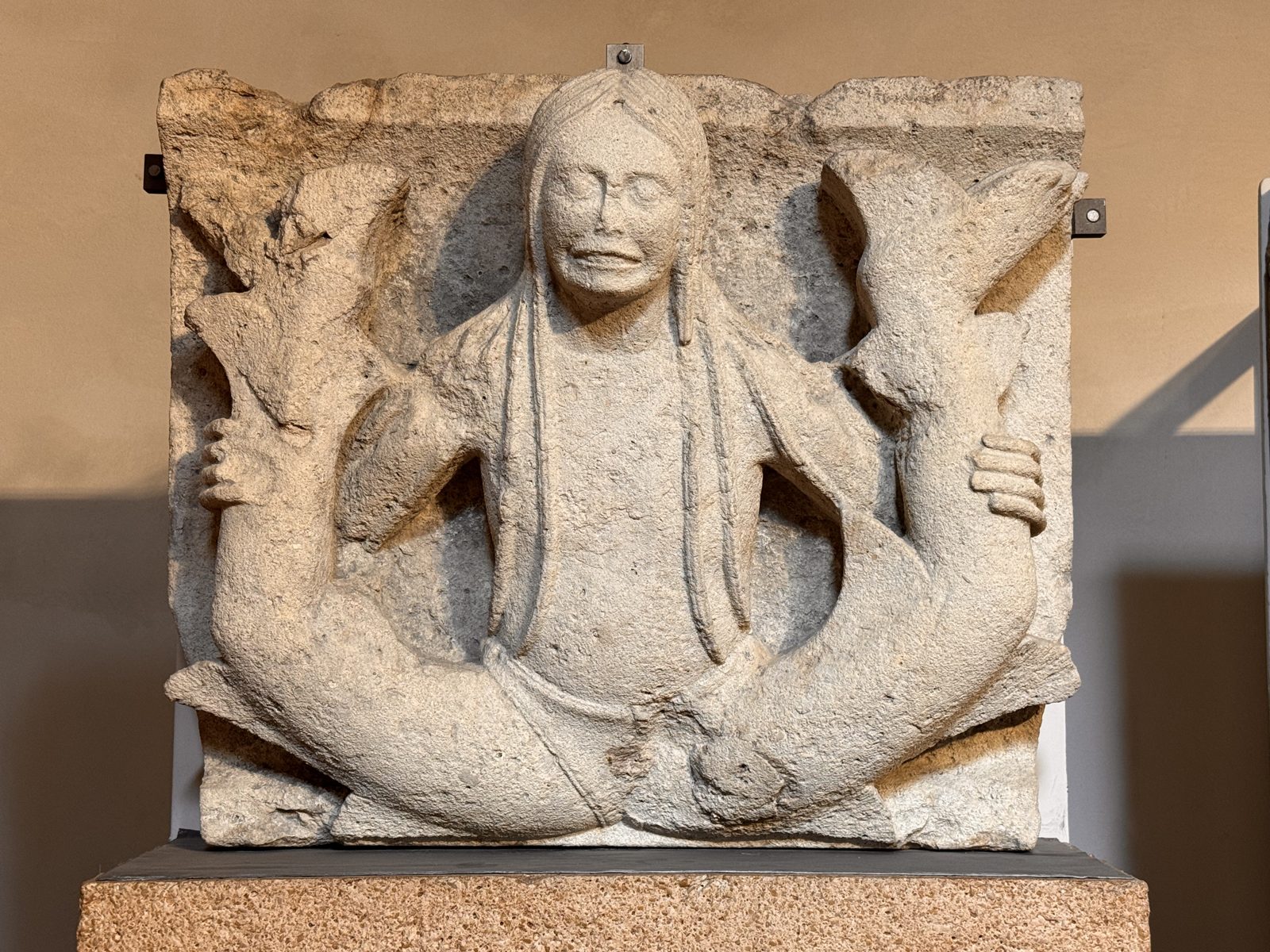 The two-tailed siren, perhaps the most famous of the metopes, with a long-haired, almost mournful face