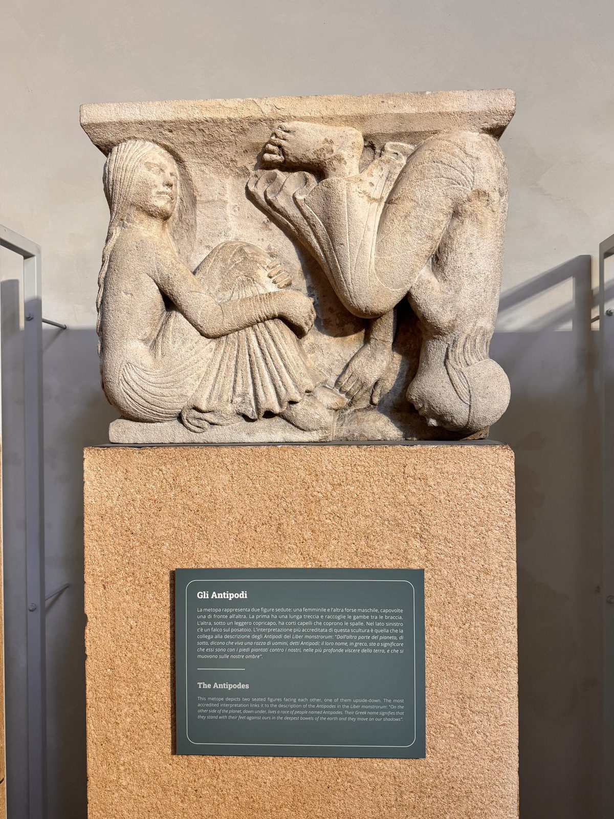 The Antipodes: two figures seated face to face, one of them upside down